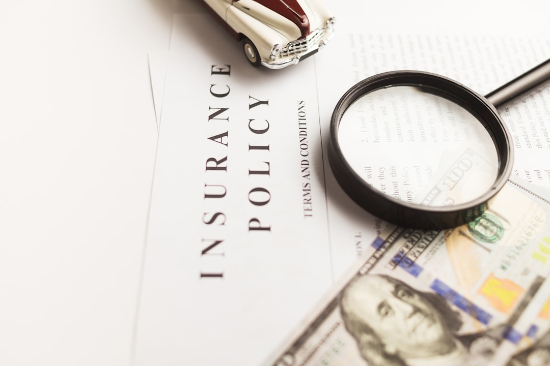 about-02 Certificate of motor insurance and policy with car and dollar bills.